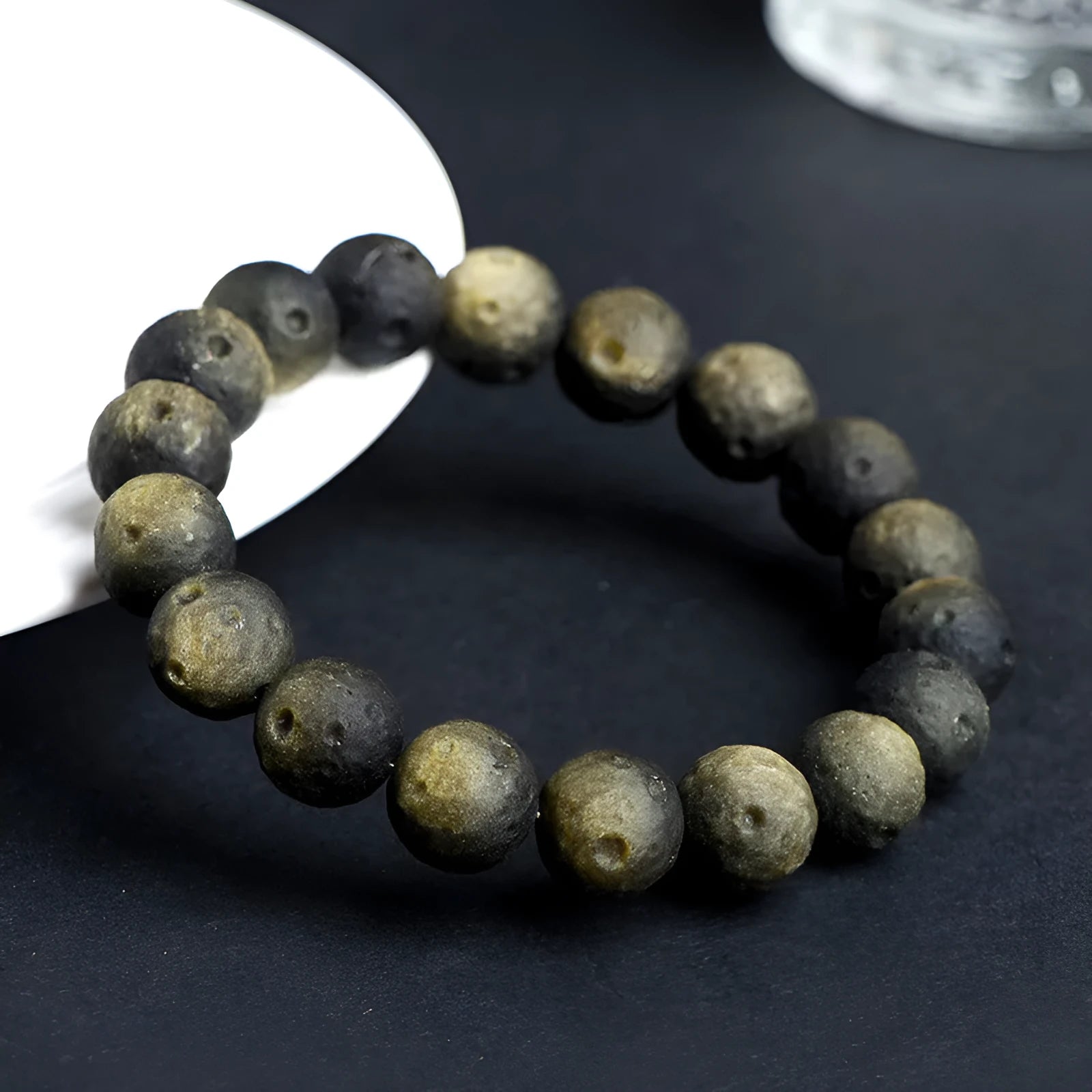 Natural obsidian crater ball bracelet with hand-ground meteorite beads in gold or silver colour options