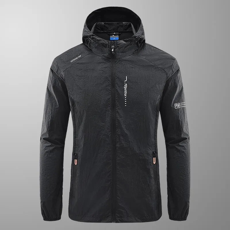 Man wearing a loose-fit light grey hooded nylon jacket for summer sun protection.
