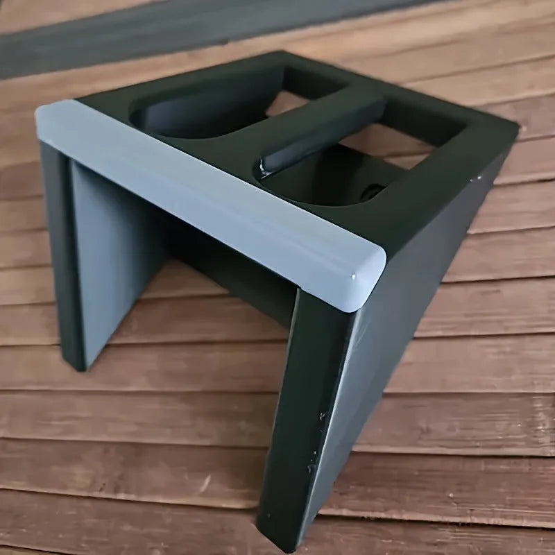 Black plastic pistol display stand with a punk-style design for gun replicas.
