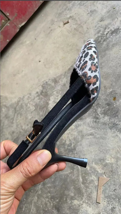 Leopard print suede women's sandals with a scattered pointed toe and high heel.