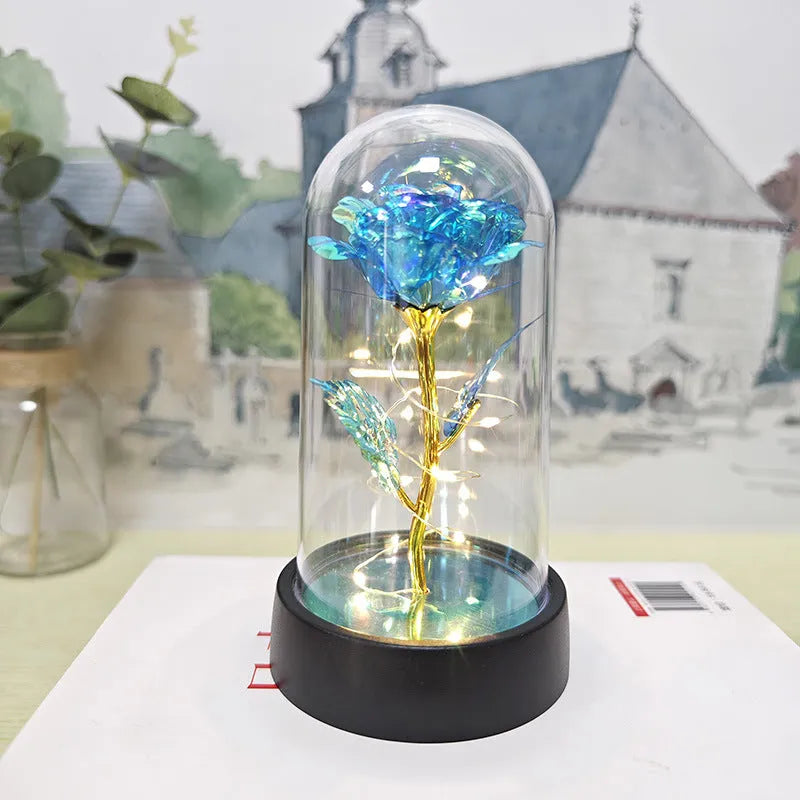 Glass cover small night lamp with plastic flowers in 15cm tall design with black base