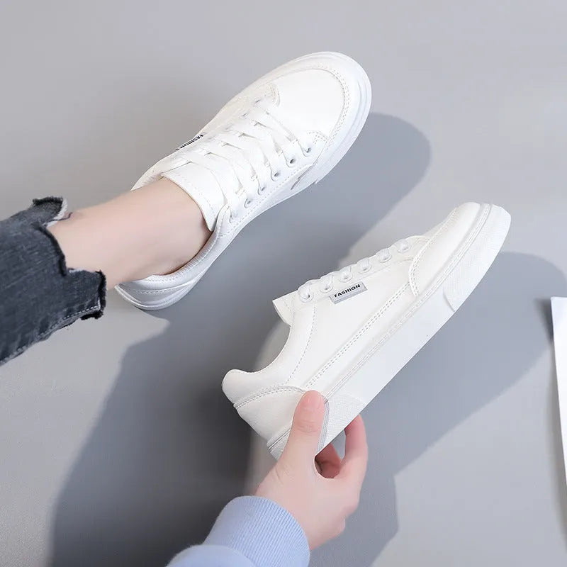 Women's low-top Korean style sneakers in white or brown artificial PU with a solid colour design.