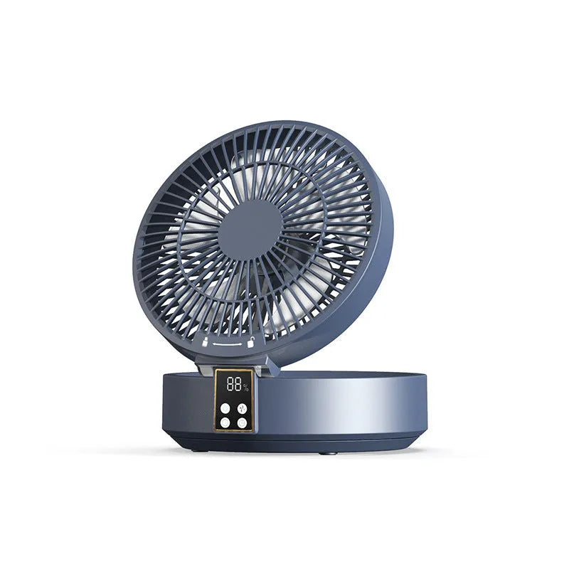 White portable rechargeable folding fan with remote control and warm night light on a desk