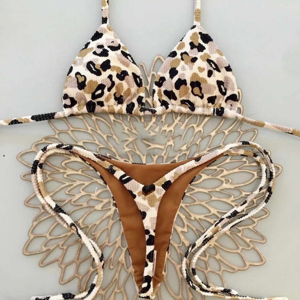 Women's briefs-style bikini swimsuit in a printed pattern, made from nylon with a cotton lining.
