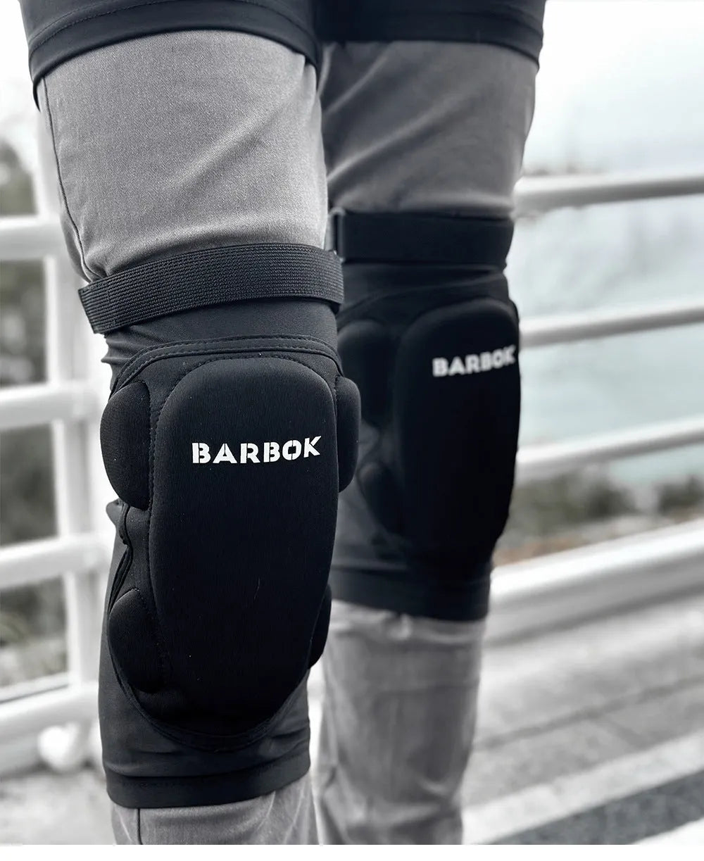 Black adult hip protection shorts with removable padding for skating and skiing safety.
