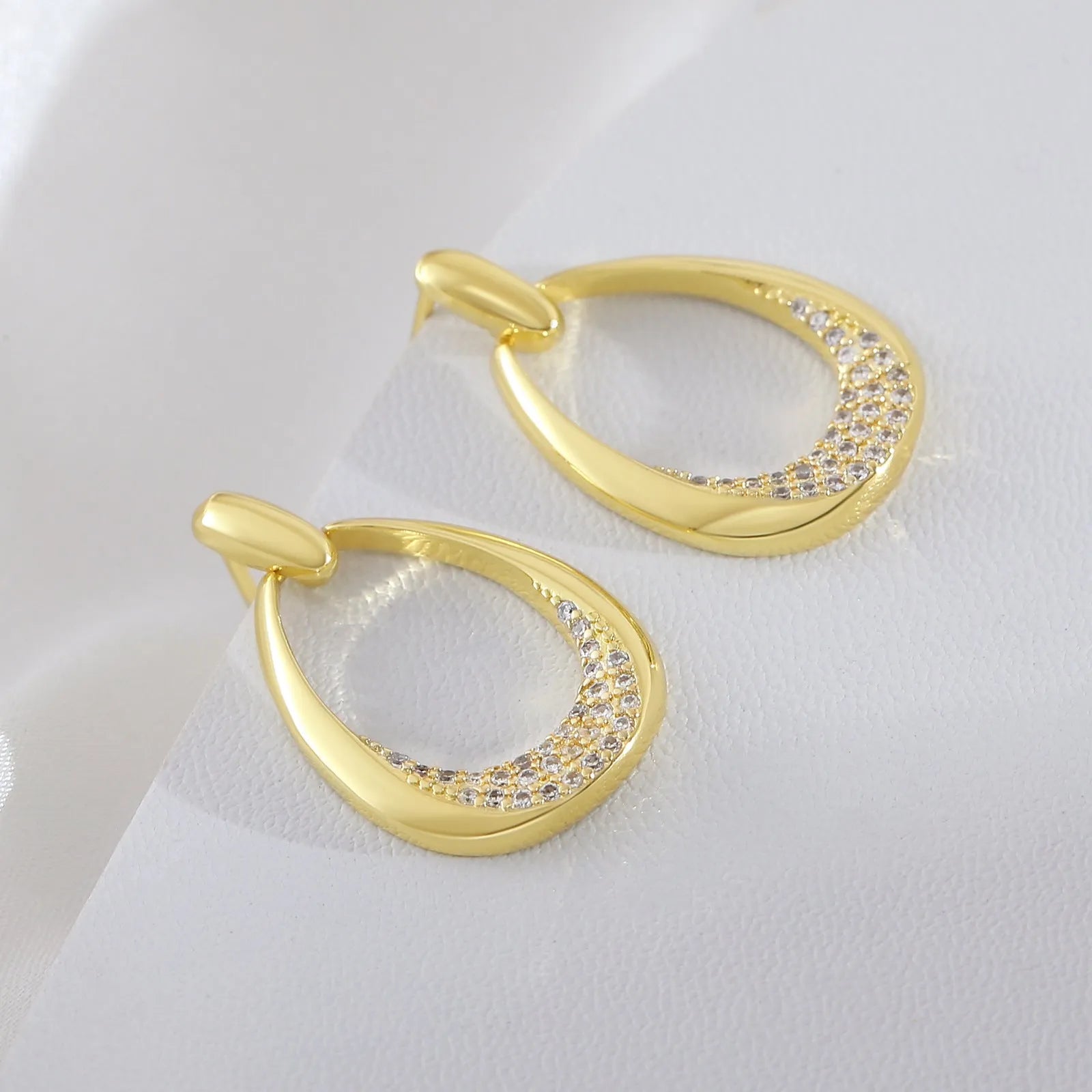Yellow gold geometric drop earrings with ring design measuring 2.6 by 1.7 centimetres
