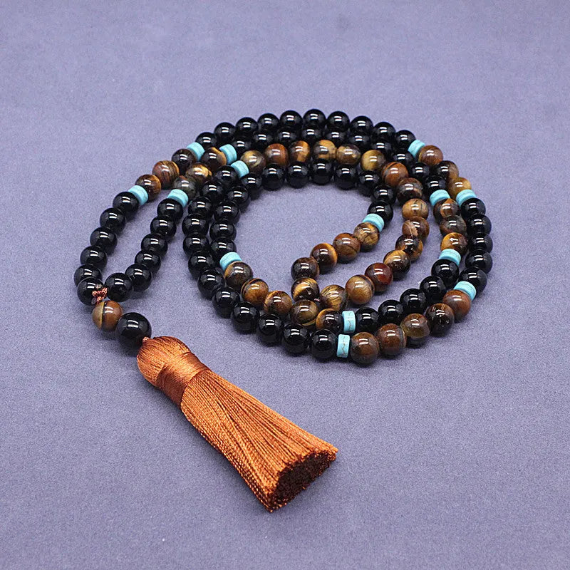 Agate and tiger's eye stone jewellery set with black bracelet and tiger-shaped pendant necklace