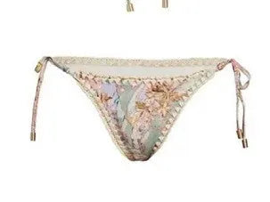 Creamy-white floral patterned women's three-piece bikini set with skirt.