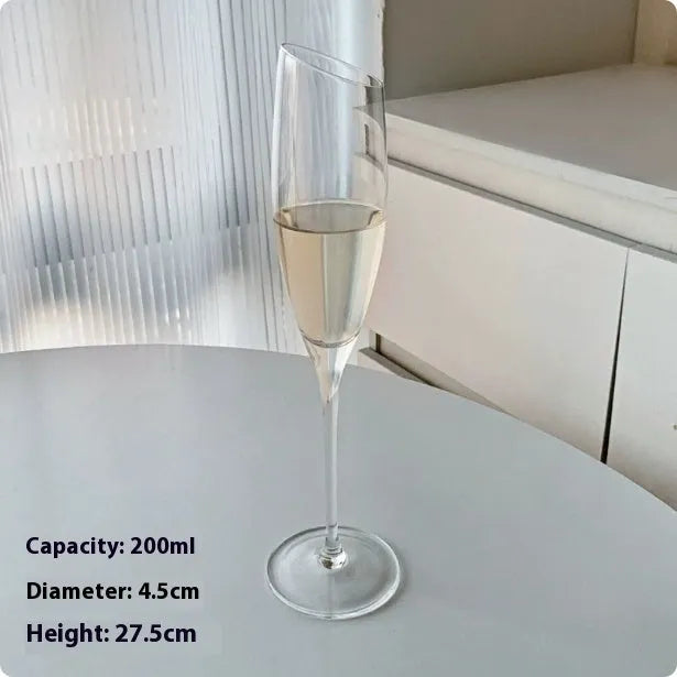 Six French crystal champagne glasses in various designs on dining table