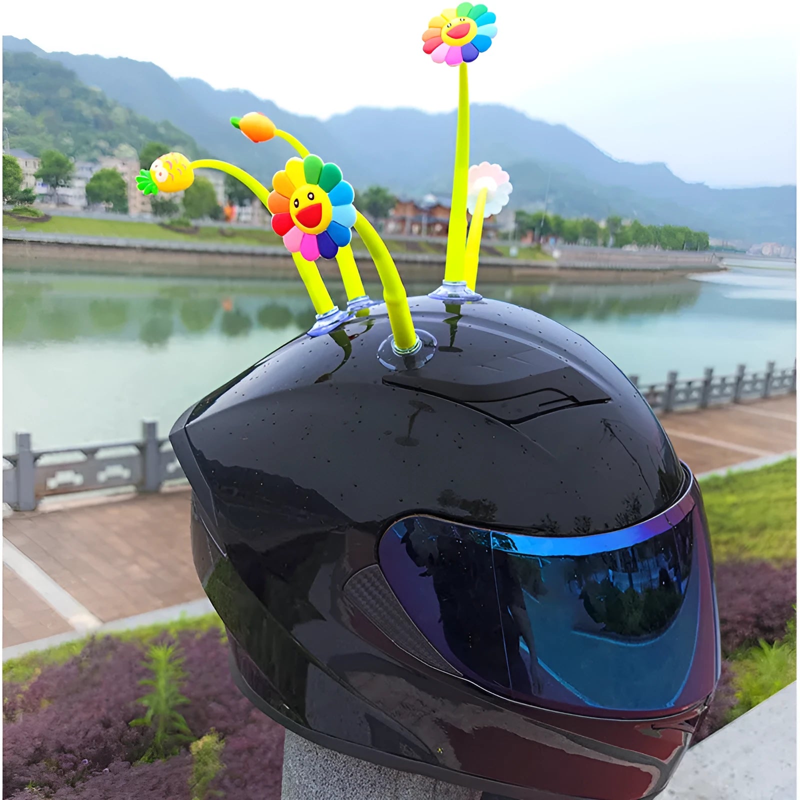 Yellow silicone sunflower decoration with a suction cup base for helmet mounting.