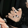Black and peach heart hand-painted artificial nails with detachable adhesive in four sizes