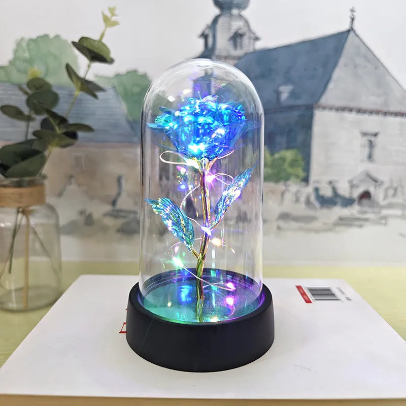 Glass cover small night lamp with plastic flowers in 15cm tall design with black base