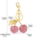 Red zinc alloy cherry pendant keychain with three-dimensional design