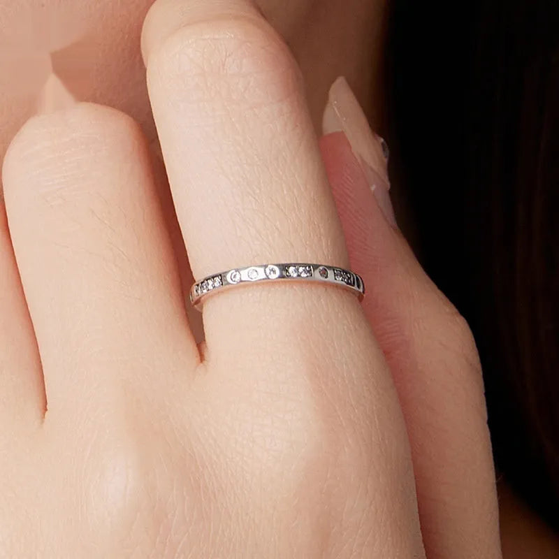 Sterling silver 'I Love You' Morse code ring with black oxidised finish on a plain background.