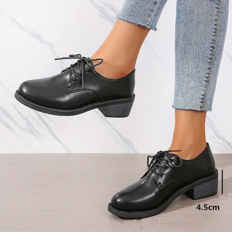 Black women's leather work shoes with thick chunky heel and pointed toe