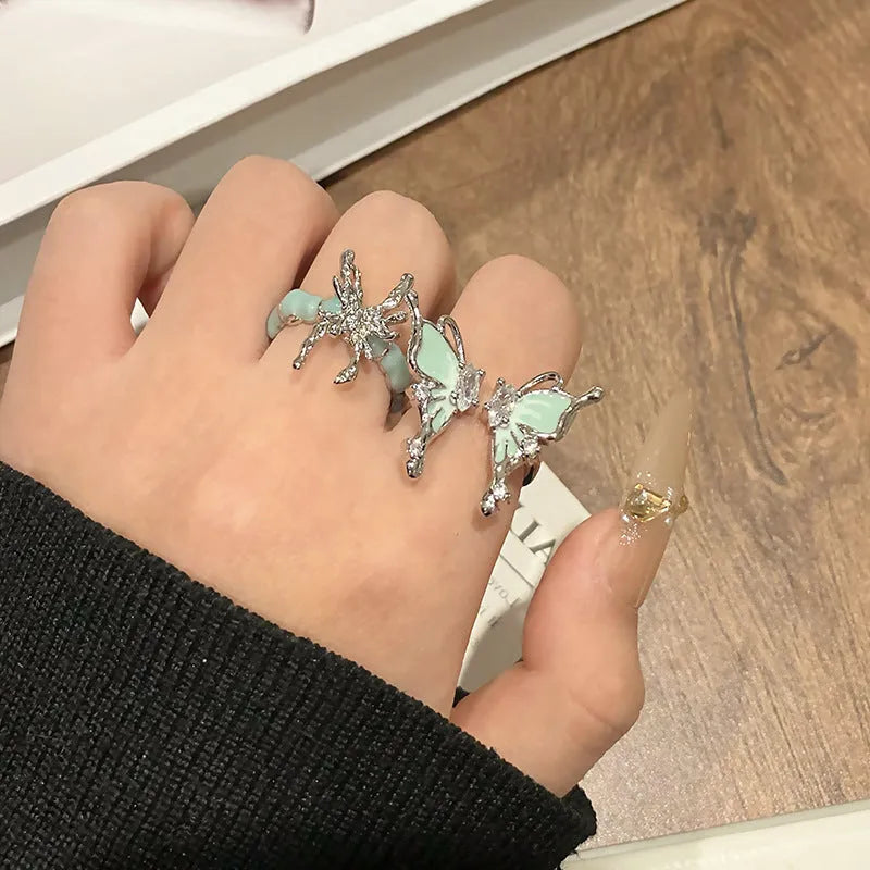 Women's butterfly design ring made from copper with an oil-drip finish, showing one of 33 colour variants.
