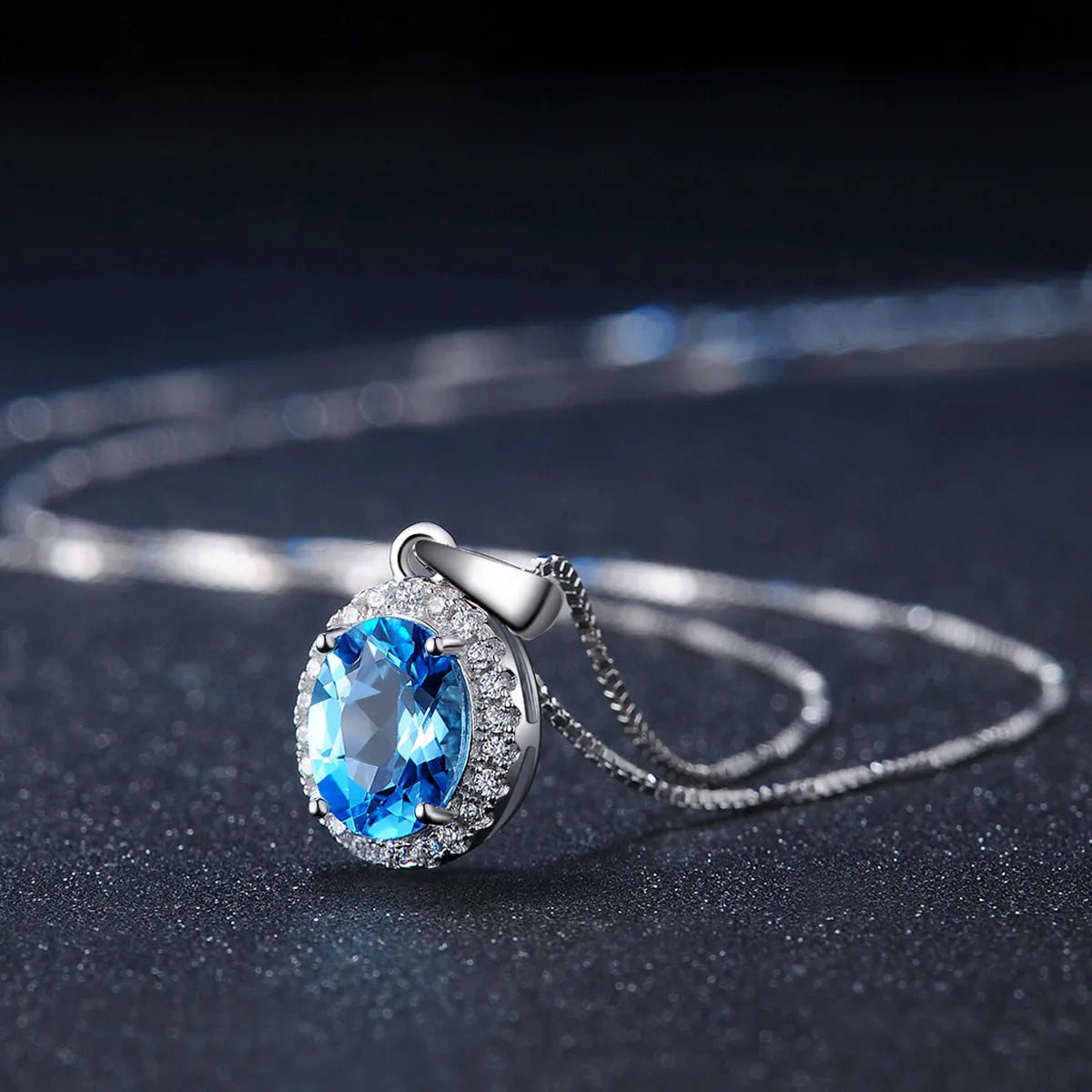 925 sterling silver jewellery set with Blue Topaz stones in geometric design including earrings, ring, pendant and necklace
