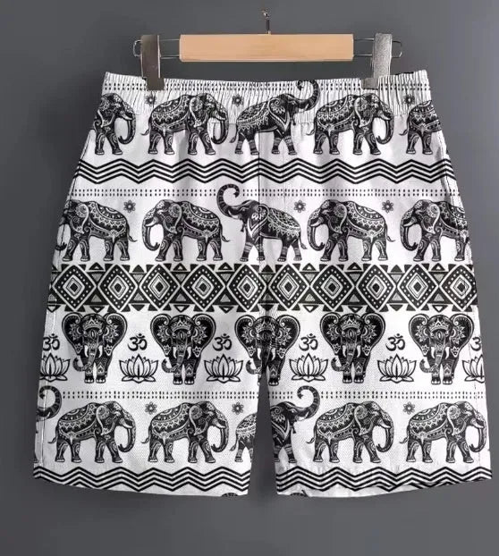 Men's casual polyester shorts in a camouflage pattern, shown in a relaxed outdoor setting.