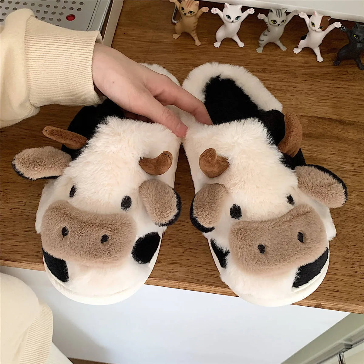 White cow plush slippers for women with non-slip textured soles