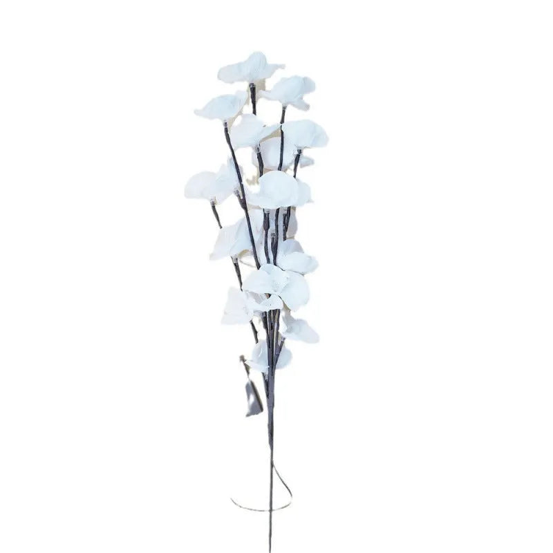 Pink LED phalaenopsis orchid branch decorative light, 65cm long, with warm white illumination on battery power.