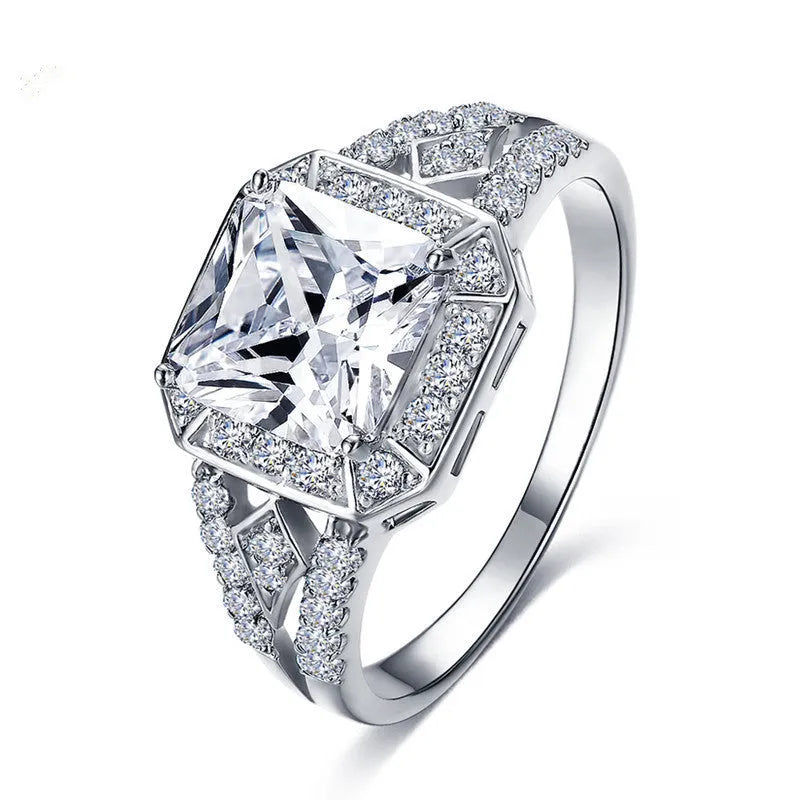 Women's platinum-coloured geometric ring with hollow design and inlaid zircon stones
