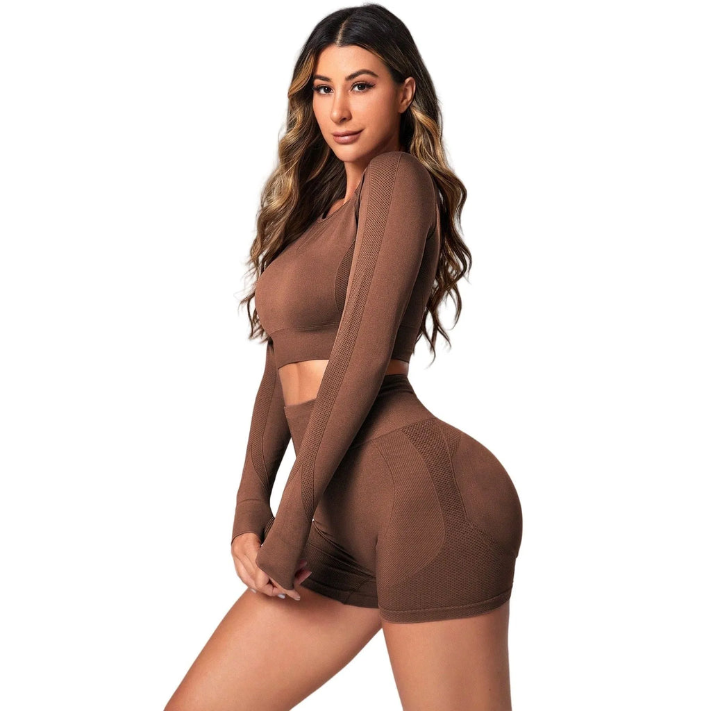 Women's black high waist yoga suit with long sleeves, consisting of matching top and pants