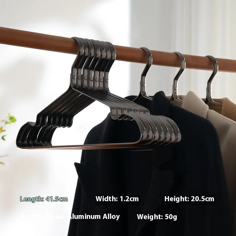 Elegant black modern clothes hanger with non-slip shoulders on a white background.