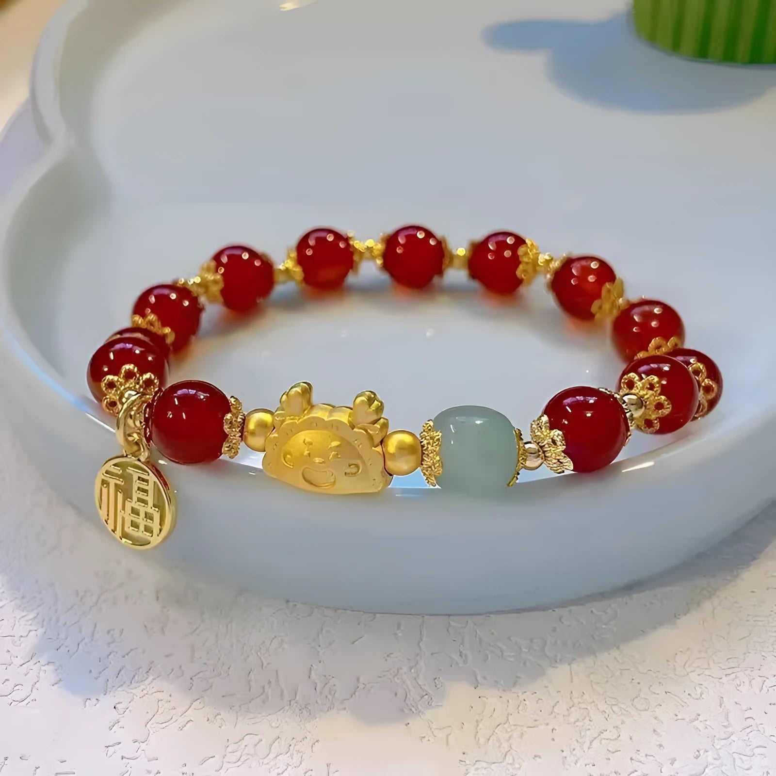 Glass floral glazed bracelet with animal zodiac modelling and electroplated red bead finish