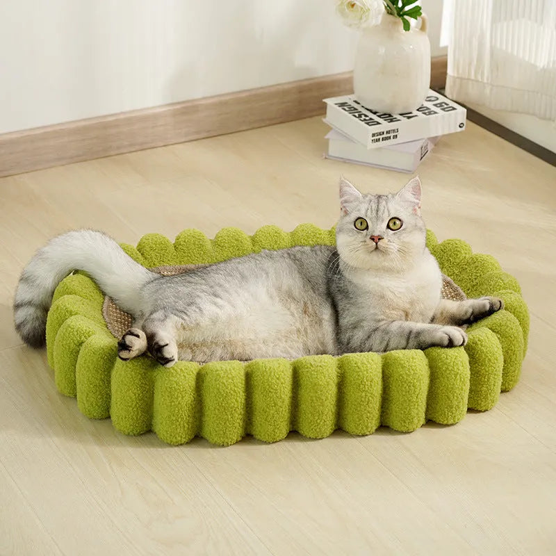 Green oval-shaped cat scratch pad bowl with sisal scratching surface, functioning as a cat bed.