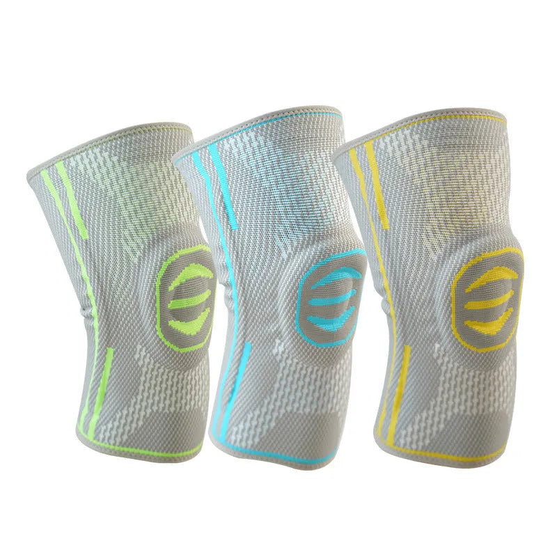 A pair of cotton mountaineering knee pads in blue, shown on a knee.
