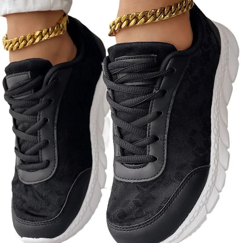 Women's canvas running shoes in white with round toe and flat heel design