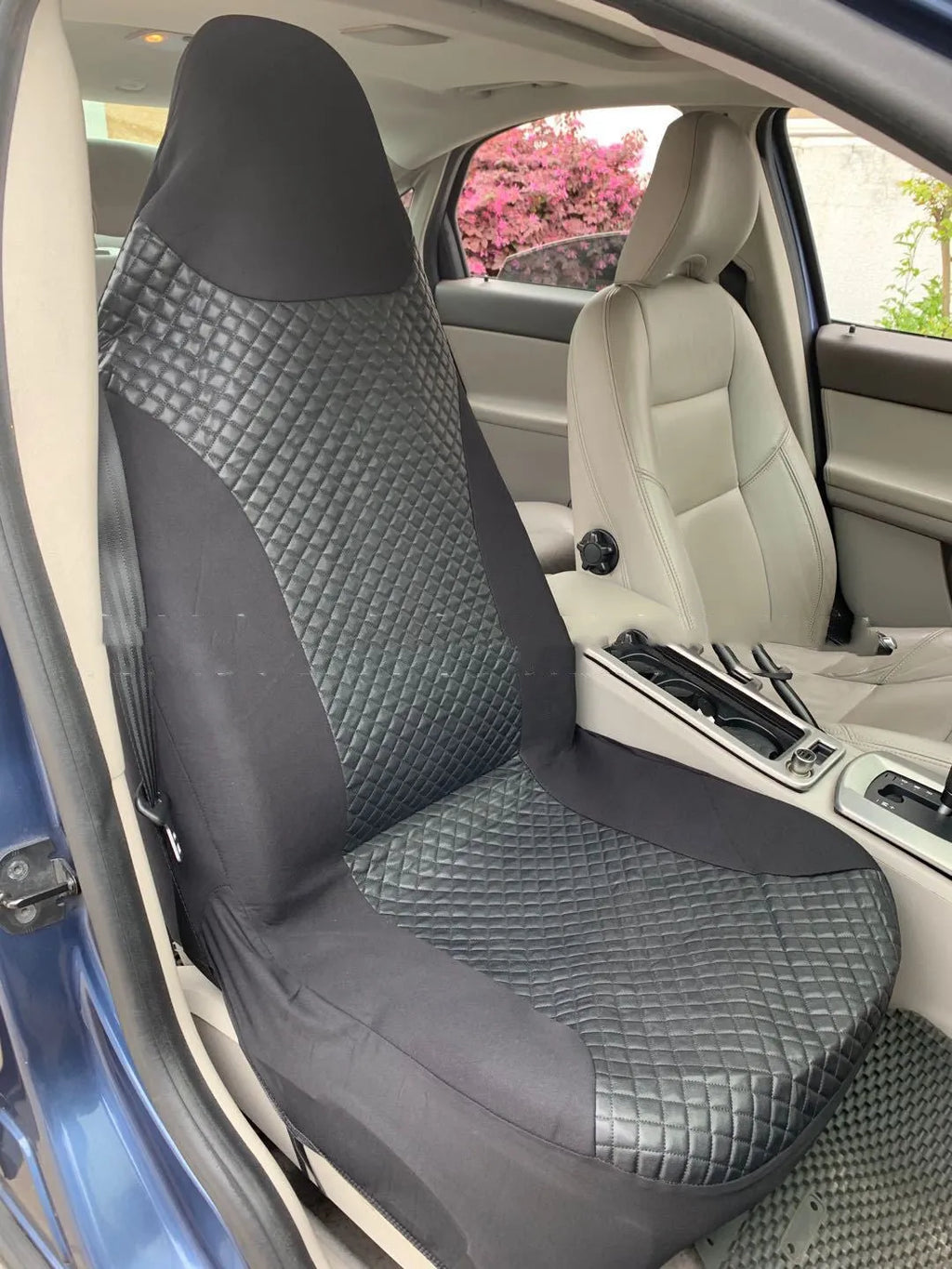 Black quilted automotive seat cover made from PU composite fabric with plastic hooks