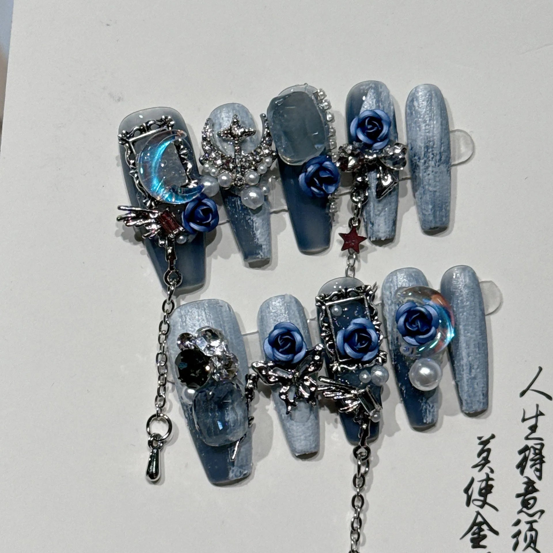 Evening manicure set in heavy industry night blue with rose, tulip, and flower patterns on plastic armour suit