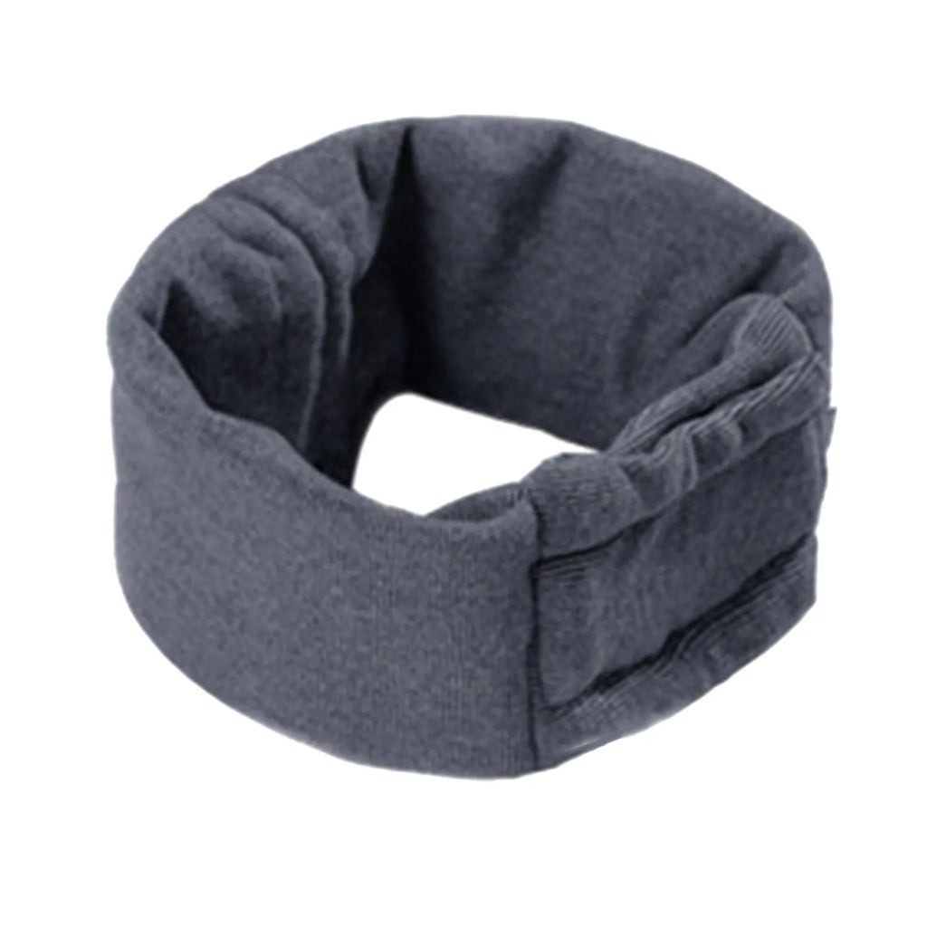 A black dog wearing a purple polyester calming hoodie that covers its head and ears.