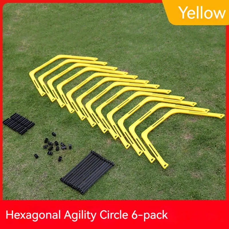 Set of six foldable yellow green and orange hexagon football agility training rings on grass