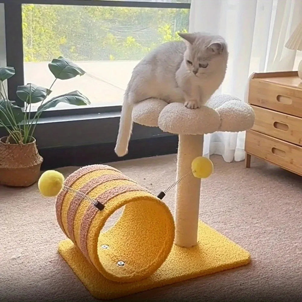 Yellow multi-level cat climbing frame with sisal scratching posts and a central tunnel.