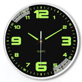 Modern 8 inch diameter luminous wall clock with silent movement on a wall.