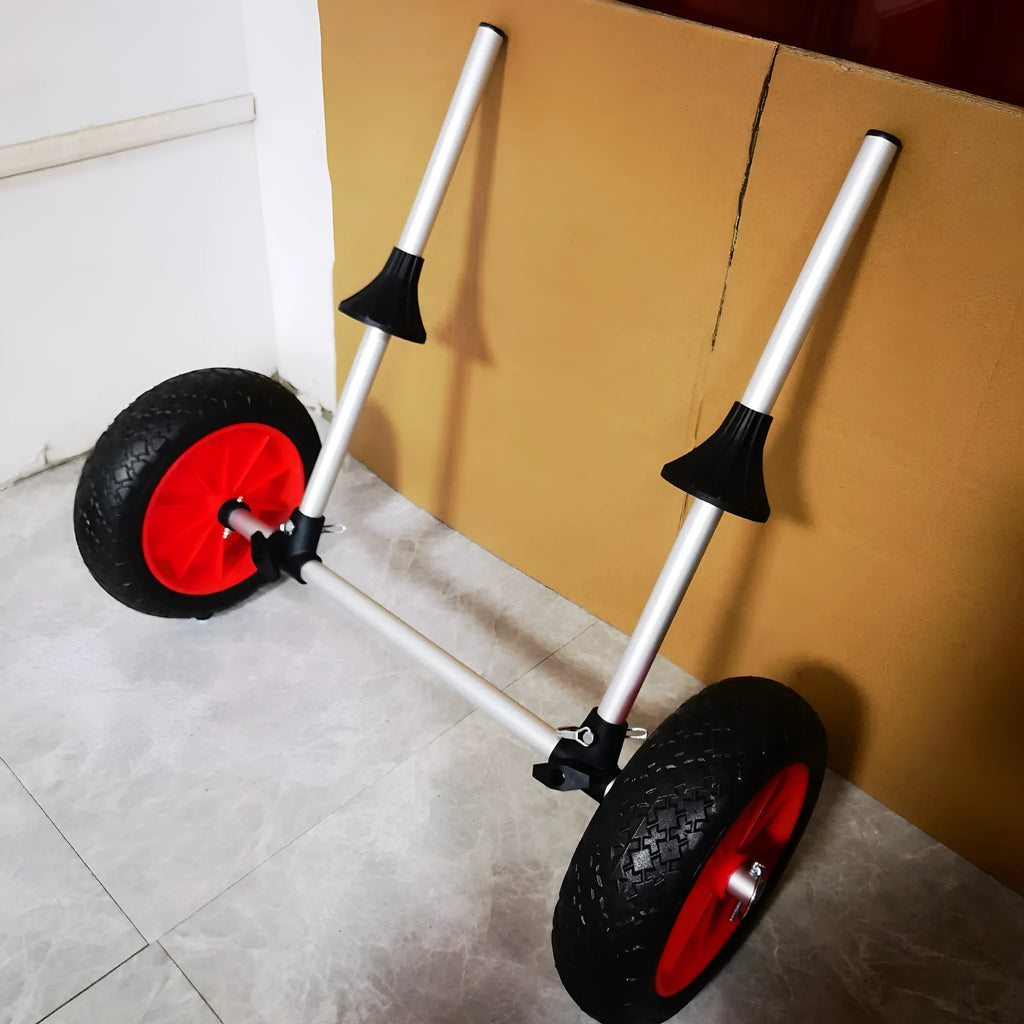 Foldable aluminium kayak cart with upright pole platform and large beach wheels for transport.