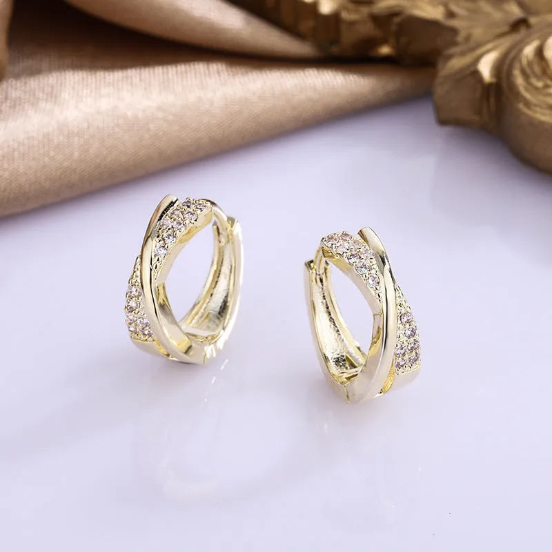 Geometric drop earrings with zircon detailing in 14K yellow gold-coloured copper