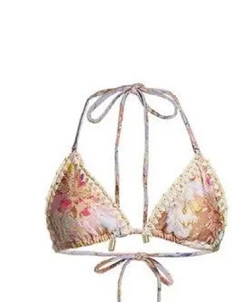 Creamy-white floral patterned women's three-piece bikini set with skirt.