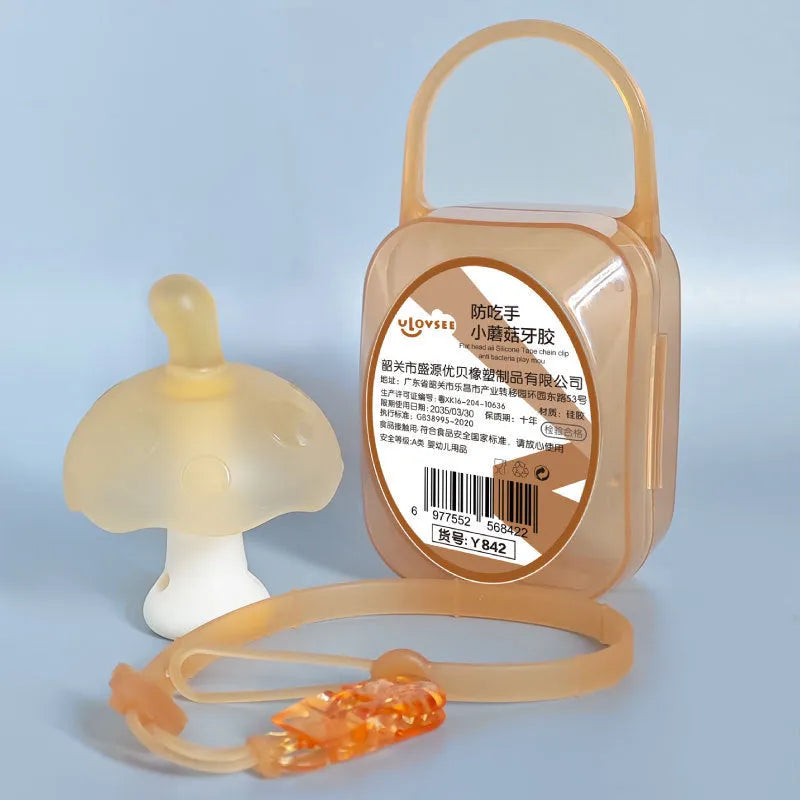 Small pink mushroom-shaped latex chewing gum in a transparent box with a chain.