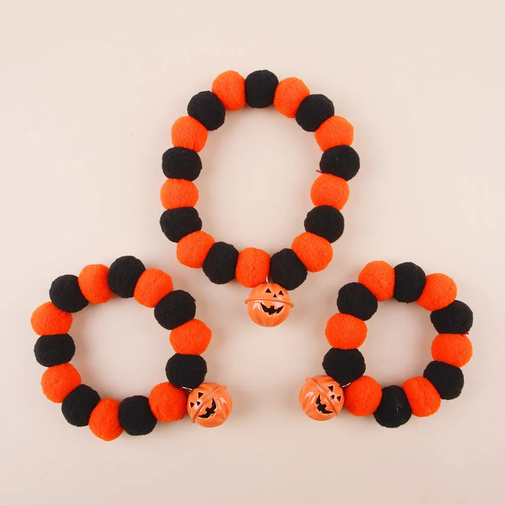 Halloween cat collar with orange pumpkin decoration and plastic buckle closure