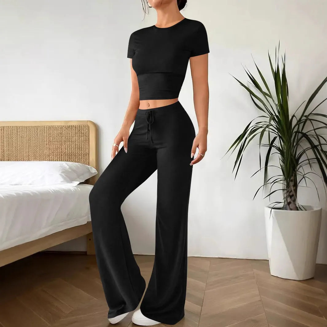 Women's black polyester trouser and T-shirt co-ord set showing complete outfit