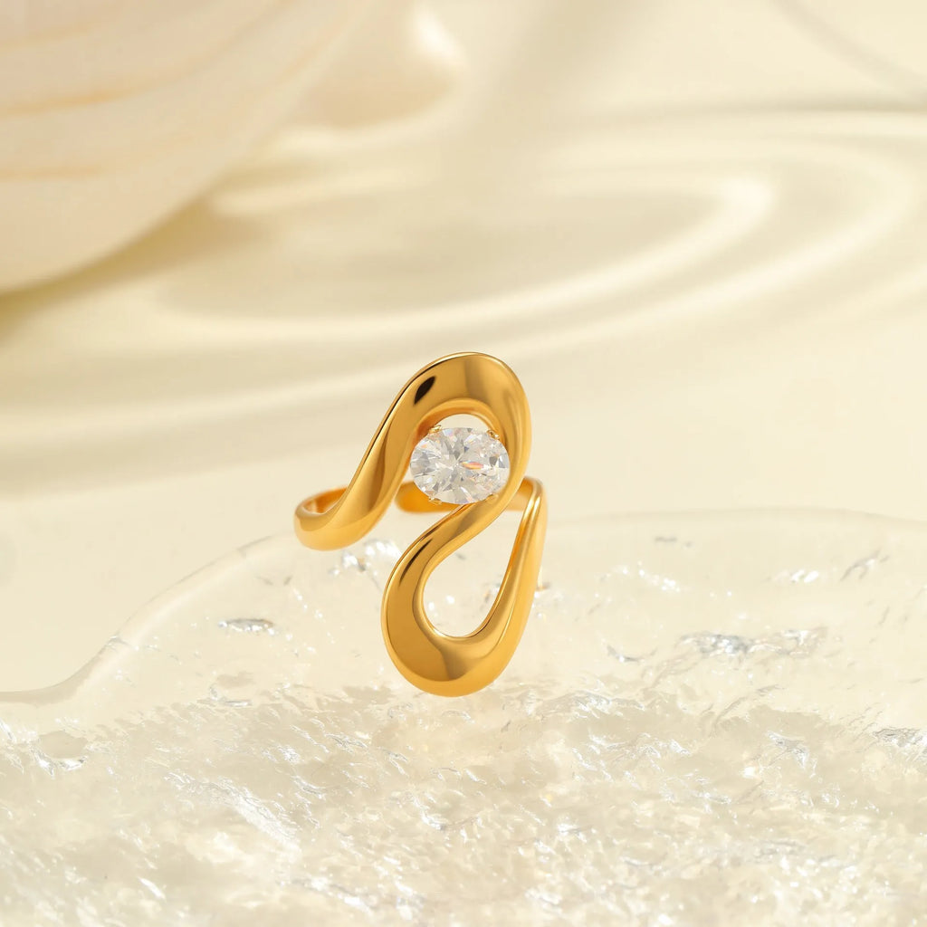 Geometric stainless steel ring with open mouth adjustable design and faceted zircon centrepiece