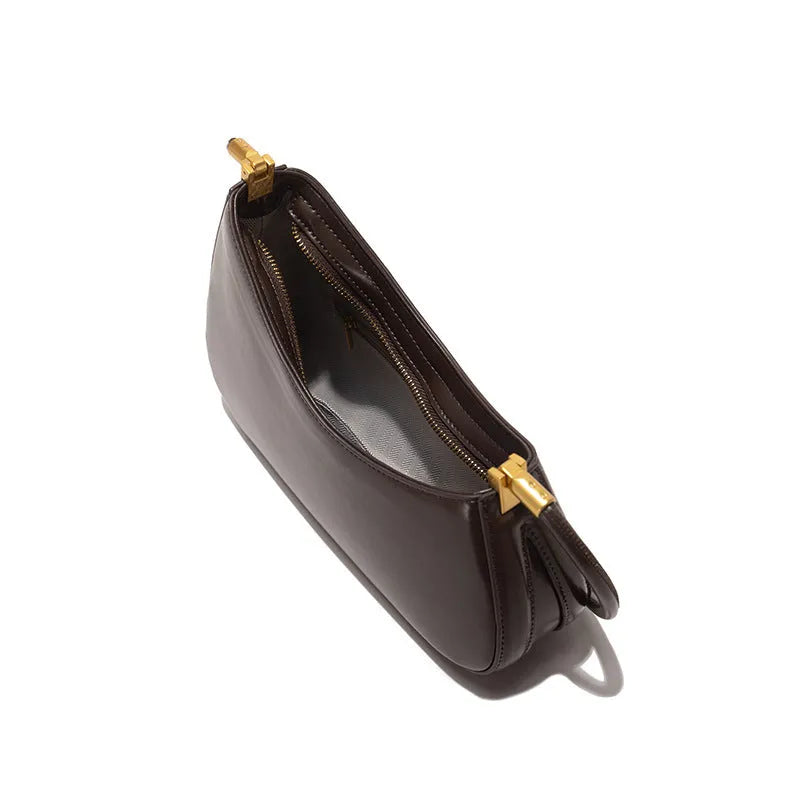 Retro oval women's underarm bag in PU leather with single shoulder strap shown in multiple colour options