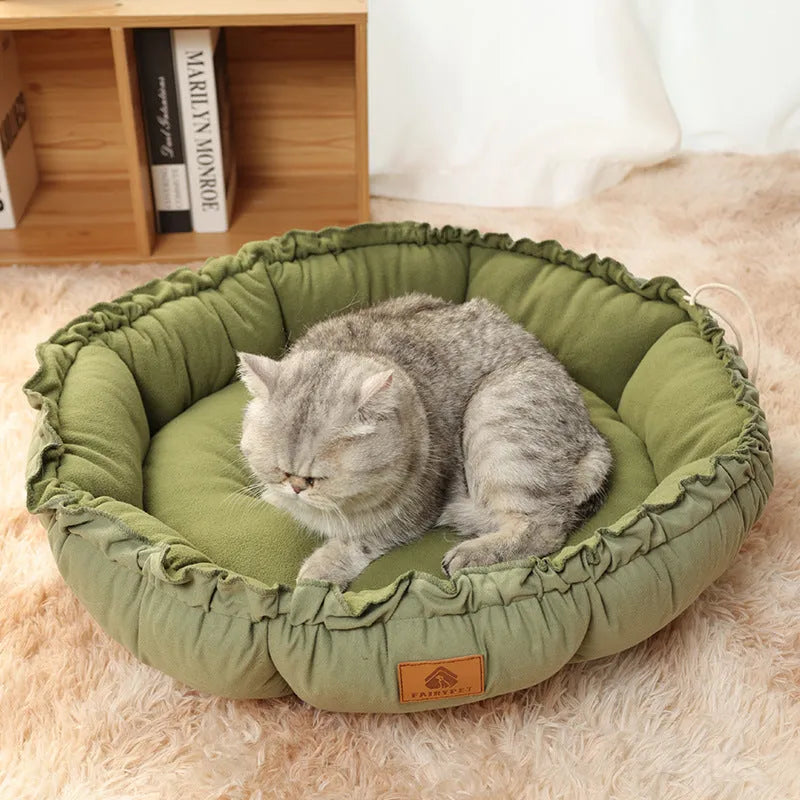 Grey donut-shaped cat bed with reversible cushion insert shown in medium size