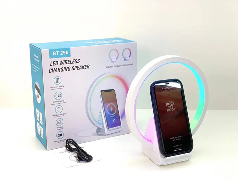 White smart Bluetooth speaker with LED ambience light and wireless charging surface