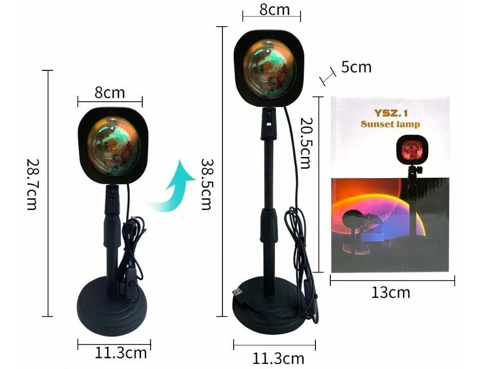 Rechargeable sunset projection lamp showing rainbow colour patterns with USB power cable