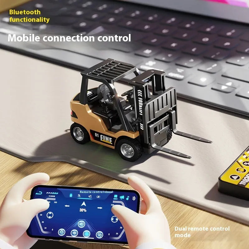 1:64 scale silver alloy Bluetooth remote-control forklift toy with mobile phone app on screen.