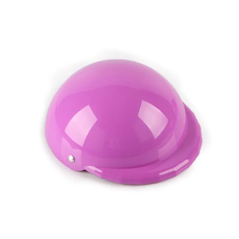 Plastic dog motorcycle cap helmet in various colours and sizes on a table